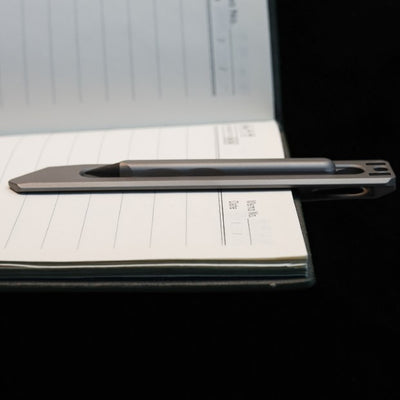 The BookBond Pen-Your Titanium Multitool Bookmark Companion